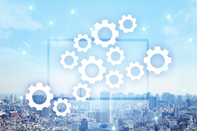 都会の背景に歯車のマーク